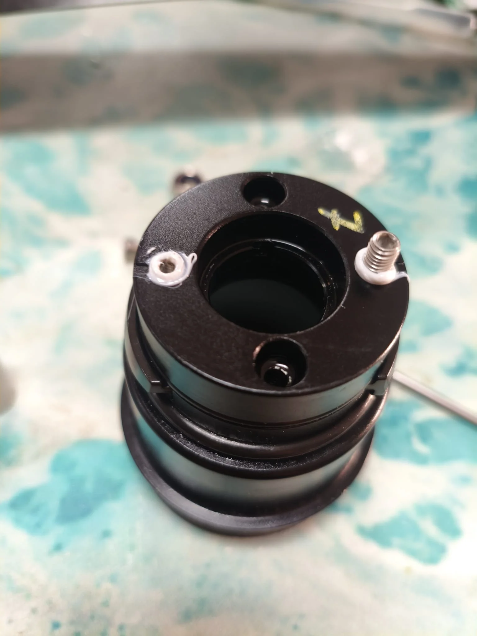 Cleaned Fliteboard motor end cap after Flite Service — new anti-seize compound visible