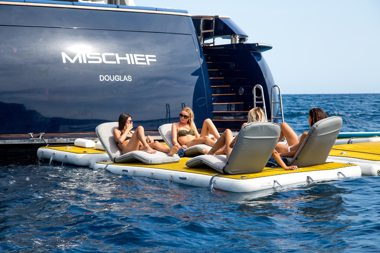 NautiBuoy Voyager 800 — superyacht-width platform in use with jet skis