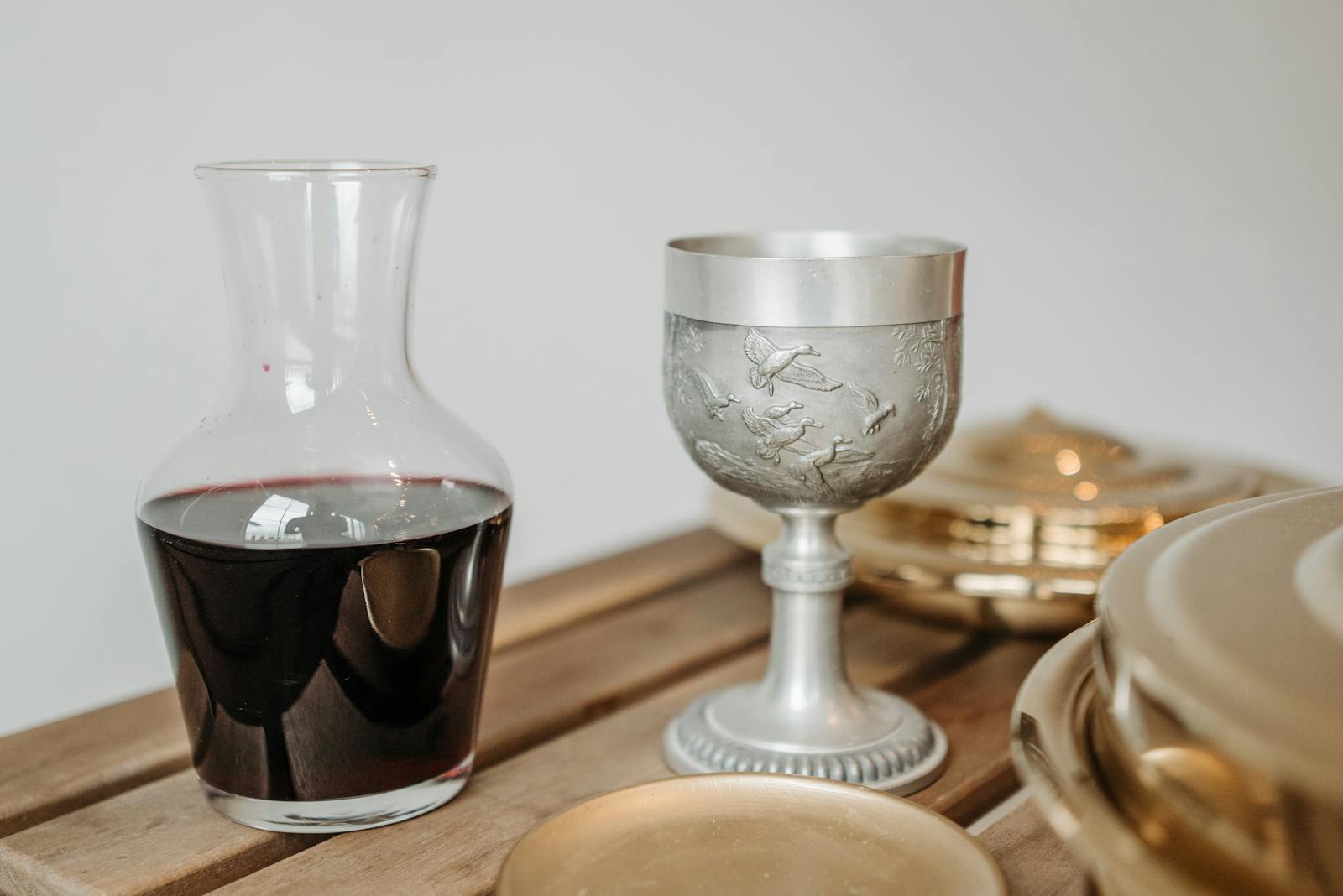 Crystal decanter and two glasses on dark wood