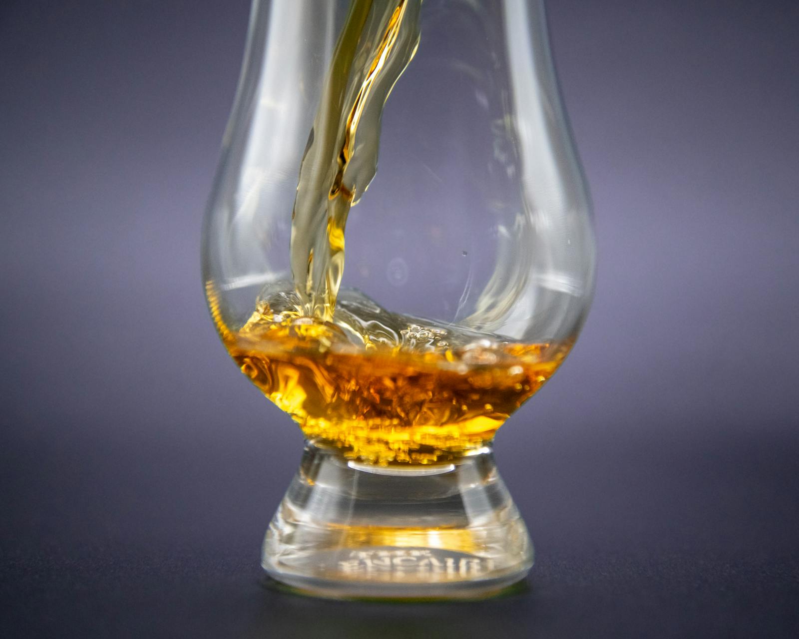 Amber whisky pour in a crystal tumbler &mdash; rare-allocation sourcing
