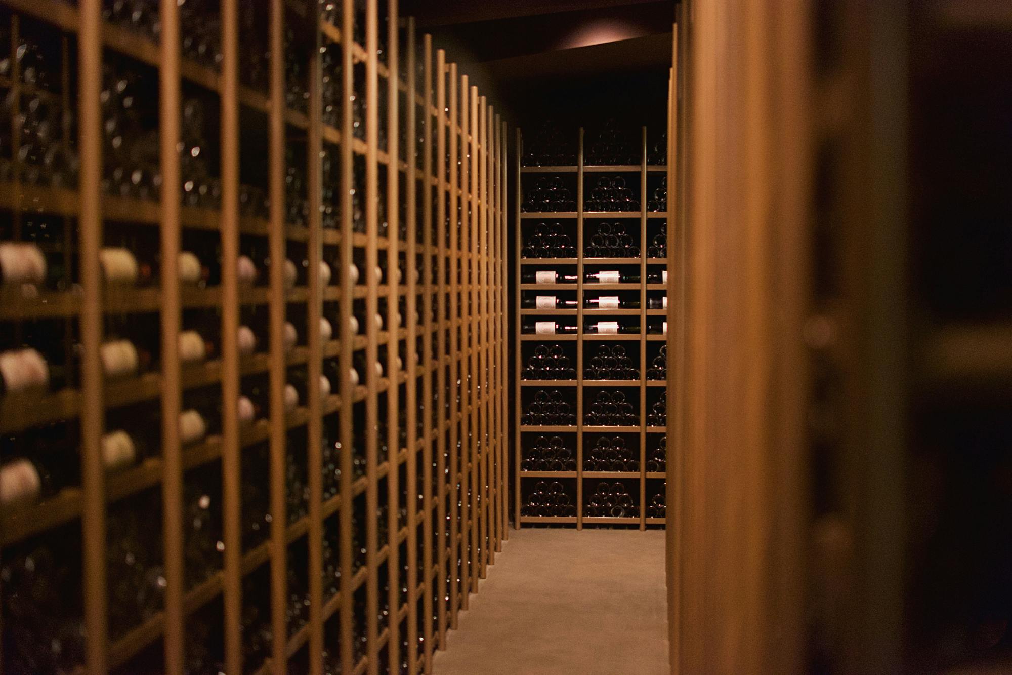Wine cellar interior with bottles on racks &mdash; Mercer Yachting curated cellar sourcing