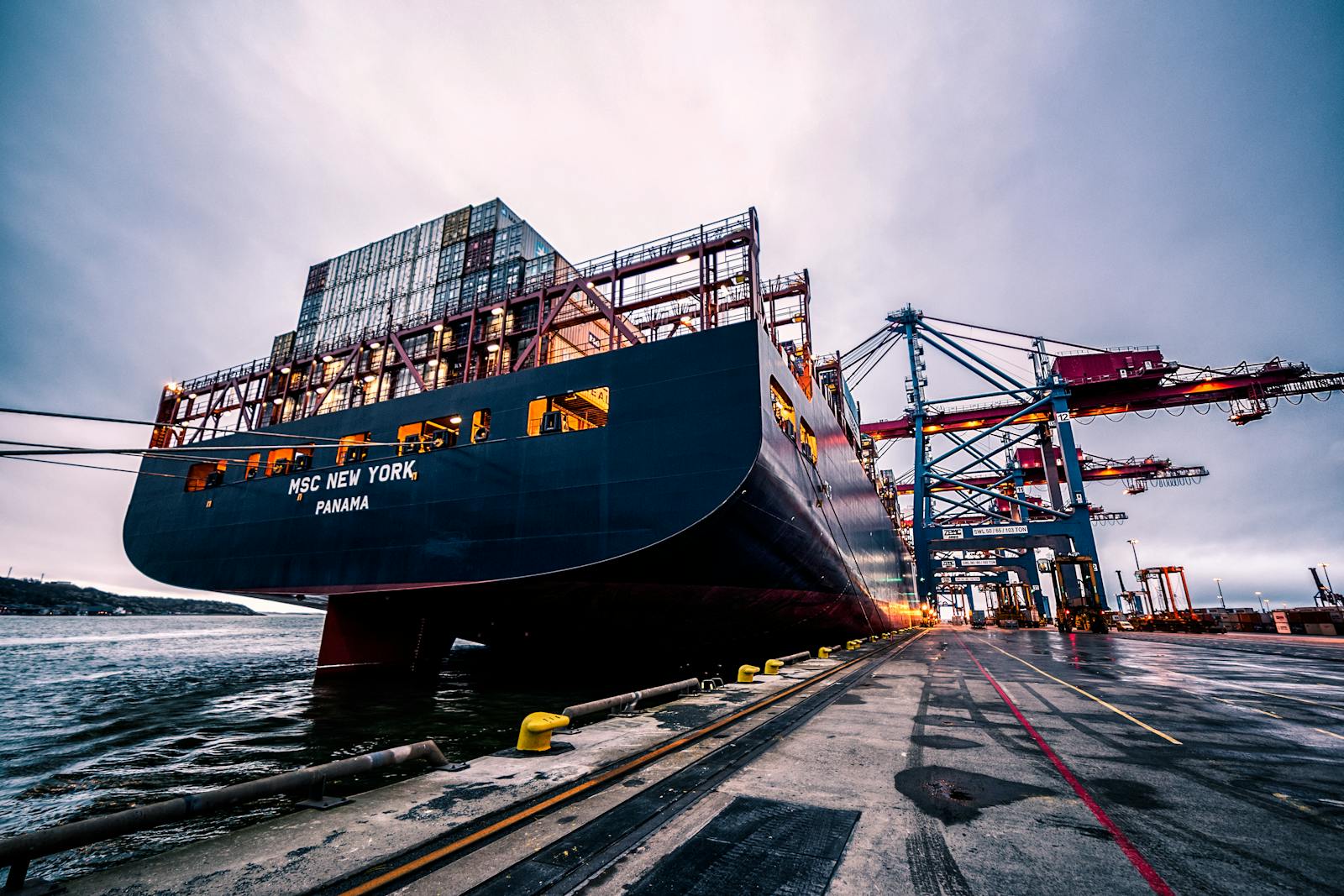 Container port at dusk &mdash; Mercer Yachting freight and customs
