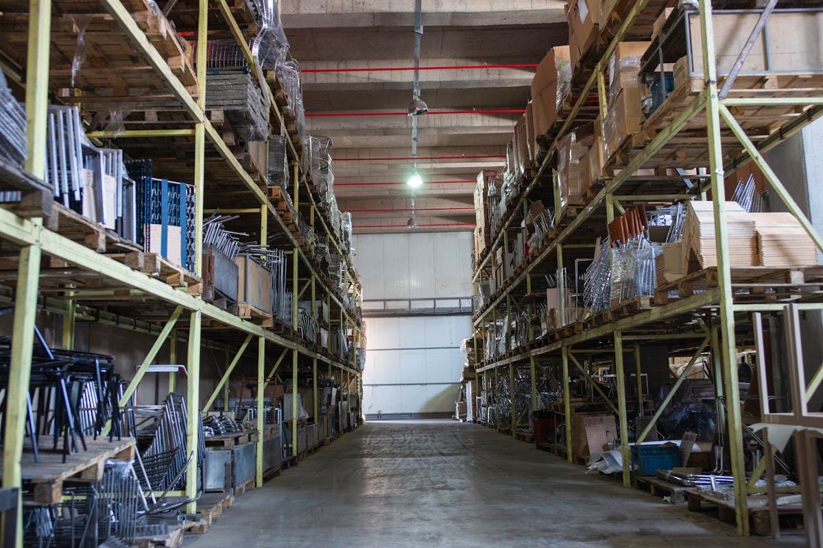 Bonded warehouse aisle with stacked dry goods &mdash; Mercer Yachting ship's stores
