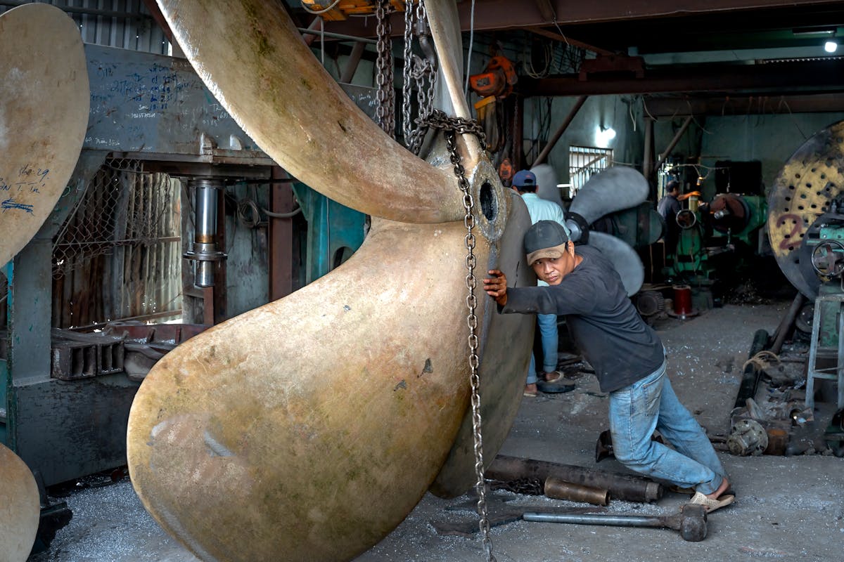 Yacht engineer working with mechanical spare part &mdash; Mercer Yachting technical procurement